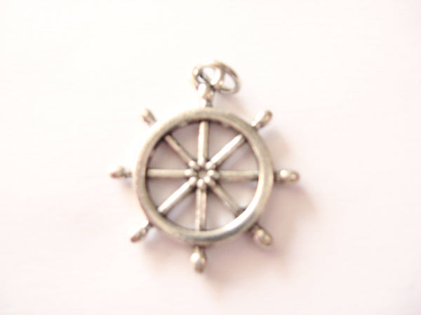 Antique silver ship's wheel charm